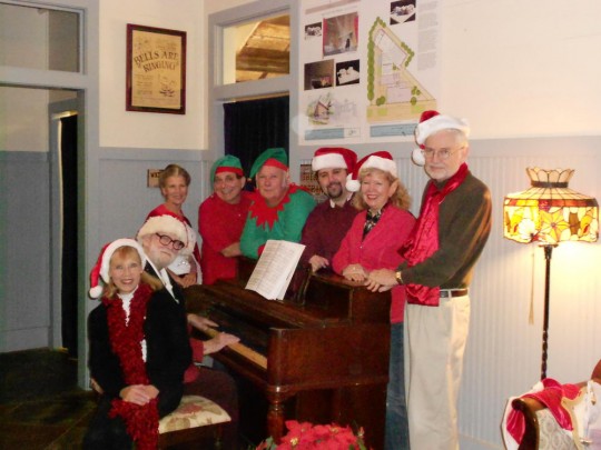 Rehearsing for Christmas comedy murder mystery dinner theater are cast members: Seated (L to R), Cheryl Grace and Bob Smith. Standing (L to R) Donna Oakley, Jimmy Duggan, Larry Clark, Brandon Everett, Penne Rappold, Richard O’Briant. Missing from the photo are Clayton Pennylegion and Lex Mauffray. Shows on December 7th and 8th at the Bay St. Louis Little Theatre.